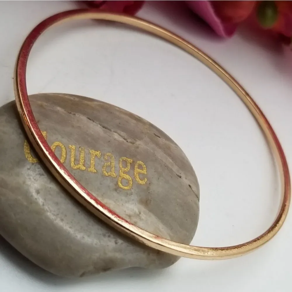Gold tone bracelet slender bangle slider. B622